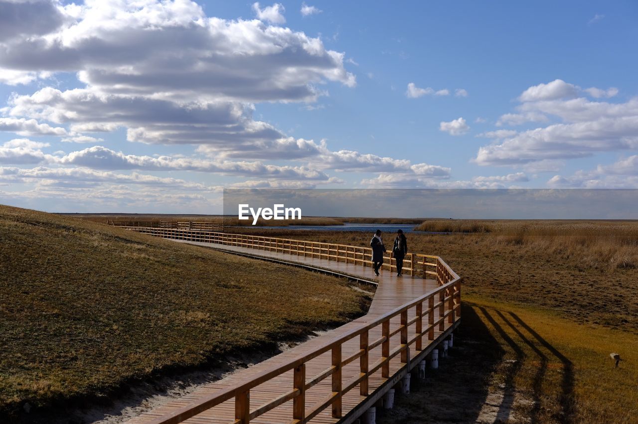 SCENIC VIEW OF ROAD ON LANDSCAPE AGAINST SKY