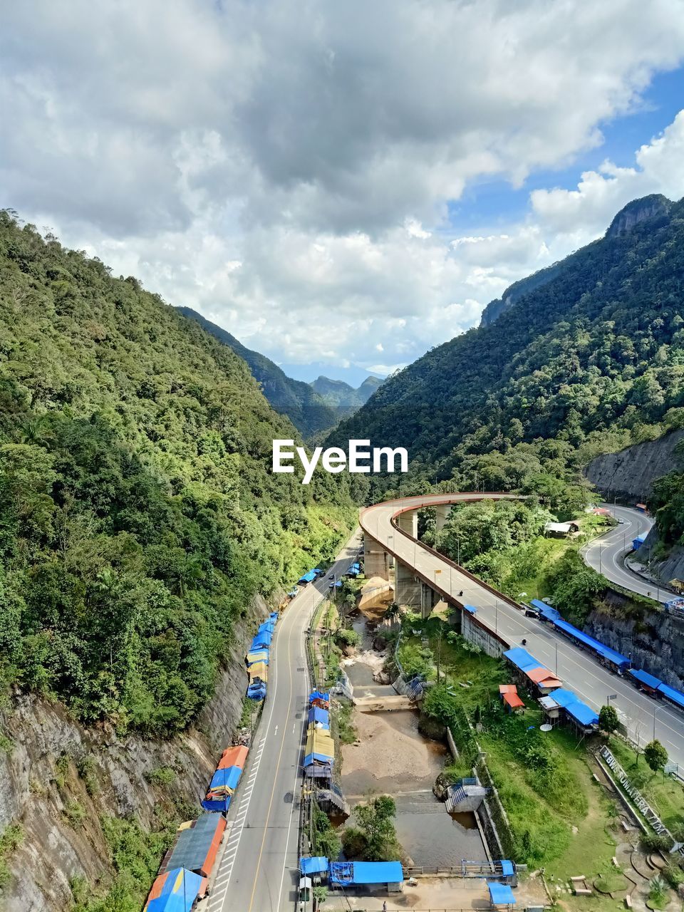 High angle view of road amidst mountains against sky