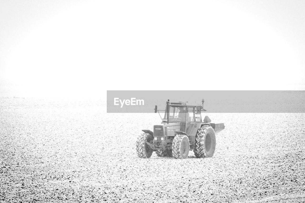 TRACTOR ON AGRICULTURAL FARM