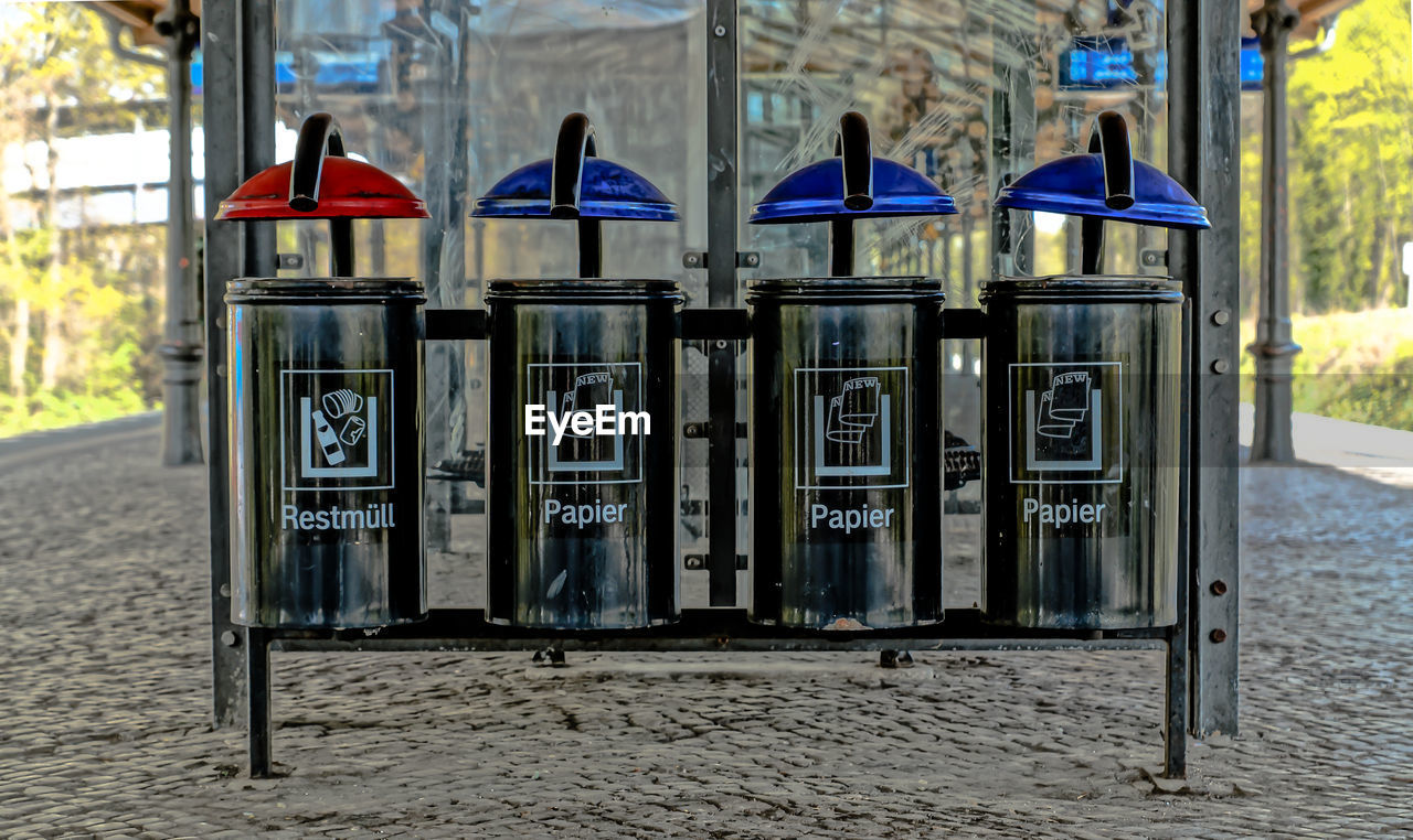 Garbage bin on railroad station in city