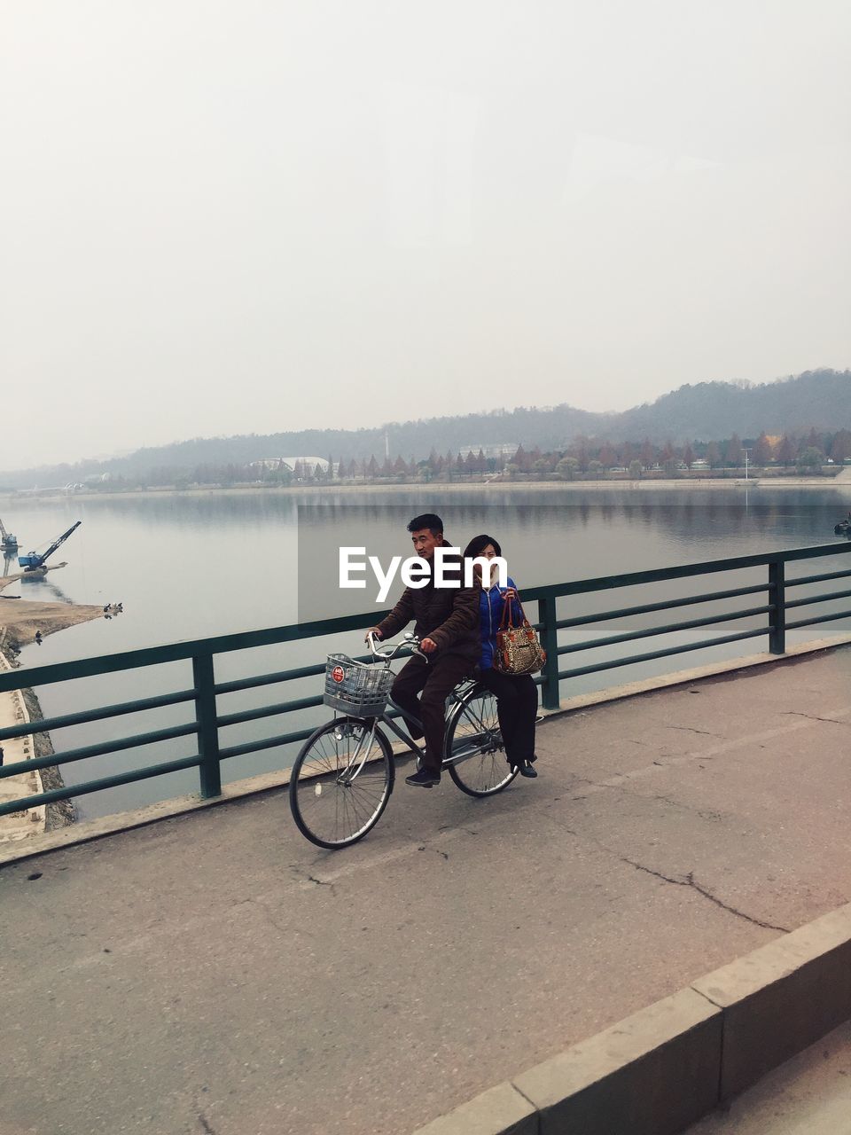 PERSON RIDING BICYCLE ON ROAD