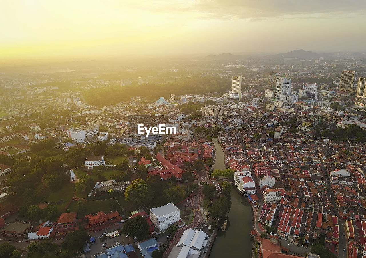 High angle view of townscape against sky at sunset