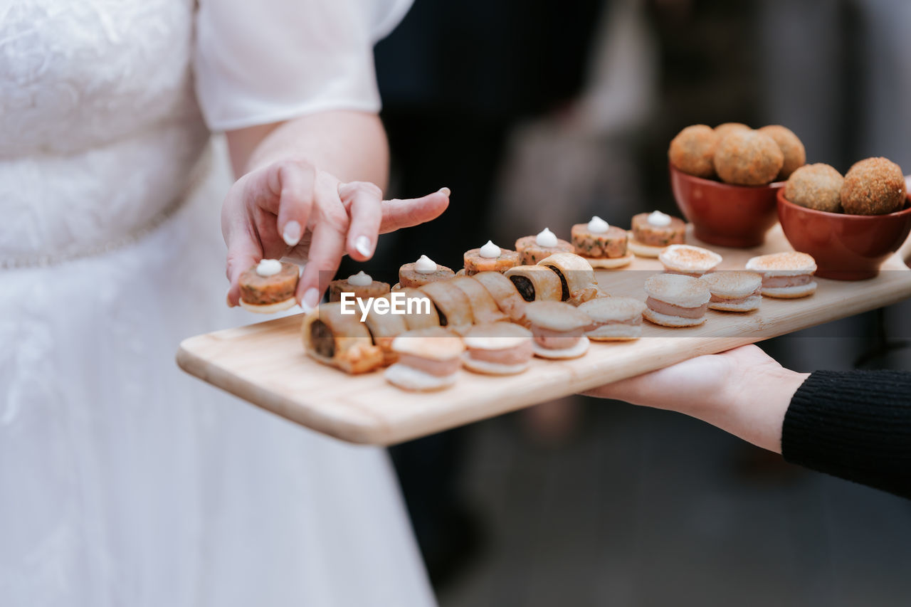 Midsection of man canopies wedding