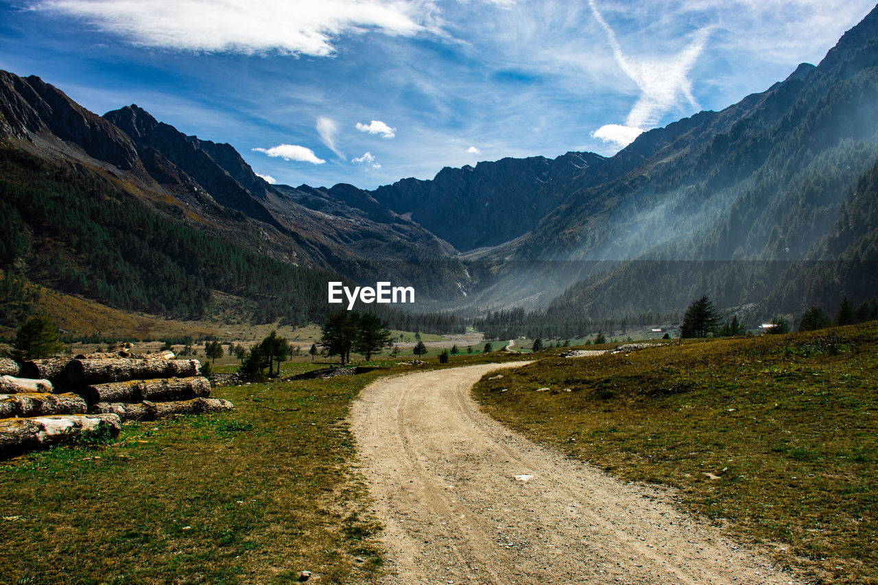 Road amidst mountains against sky