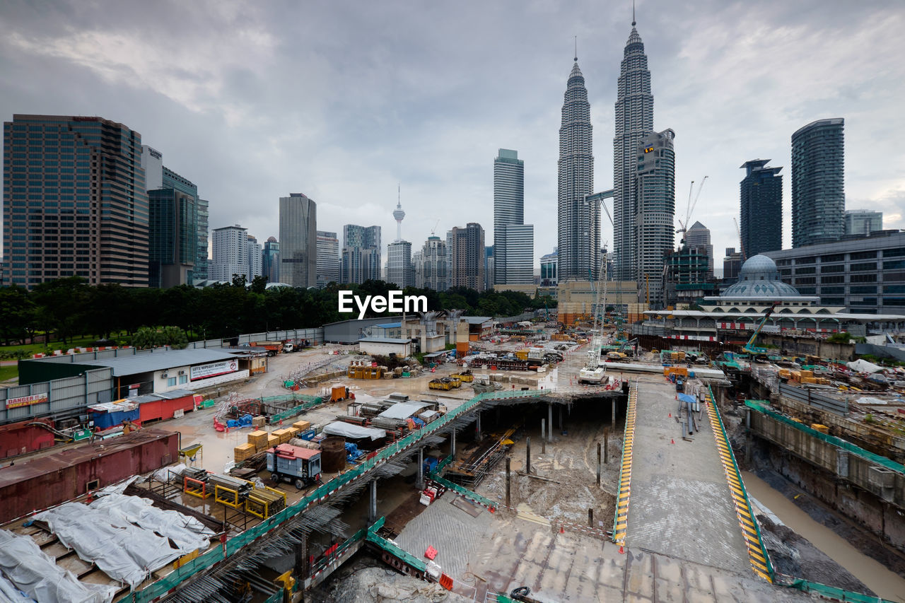 High angle view of city against cloudy sky