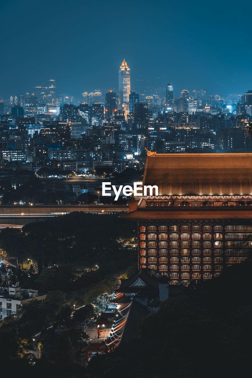 Illuminated buildings in city at night