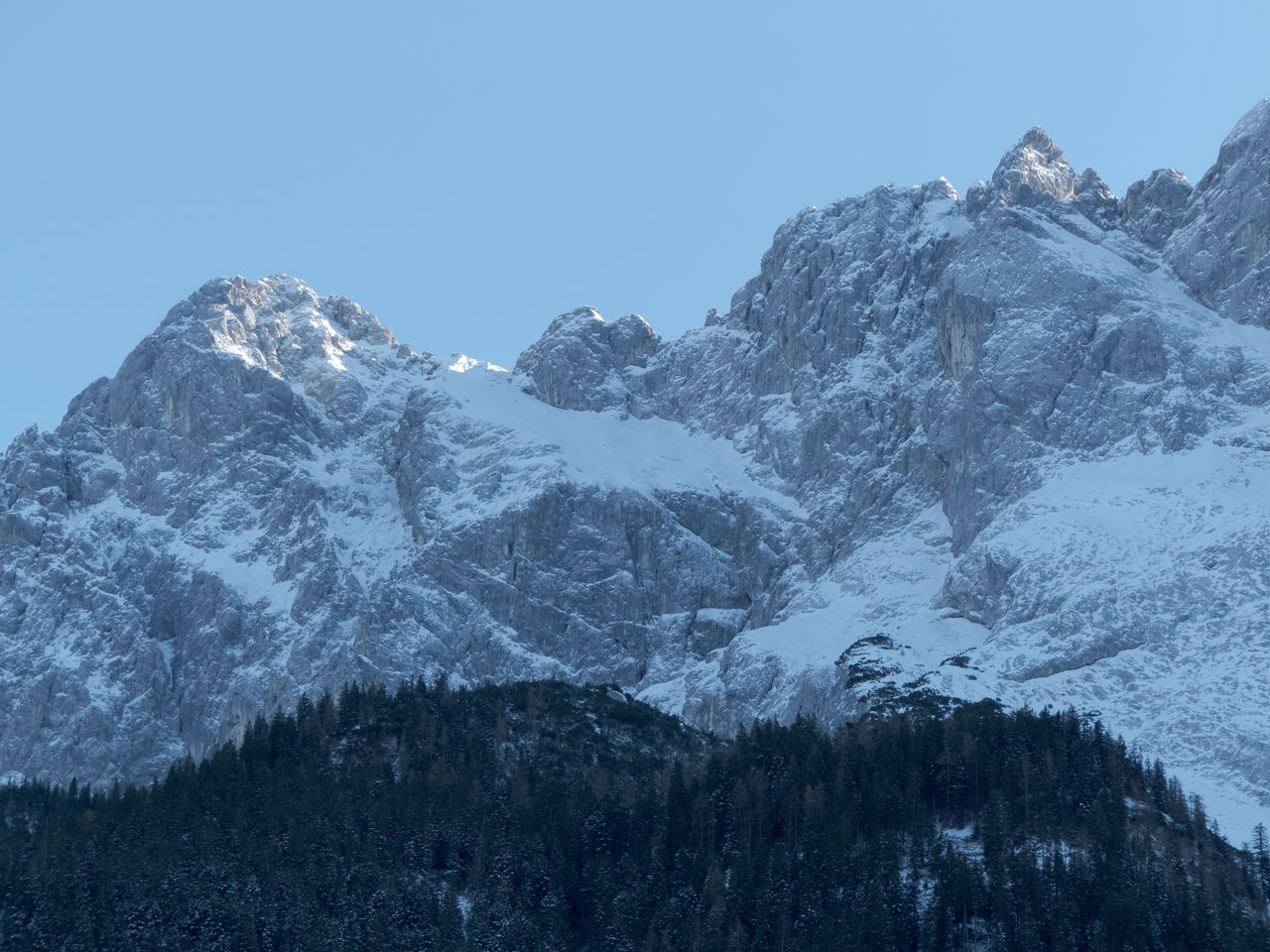 Scenic view of snowcapped mountains against clear sky