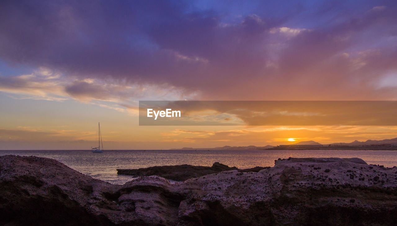 Scenic view of sea against sky during sunset