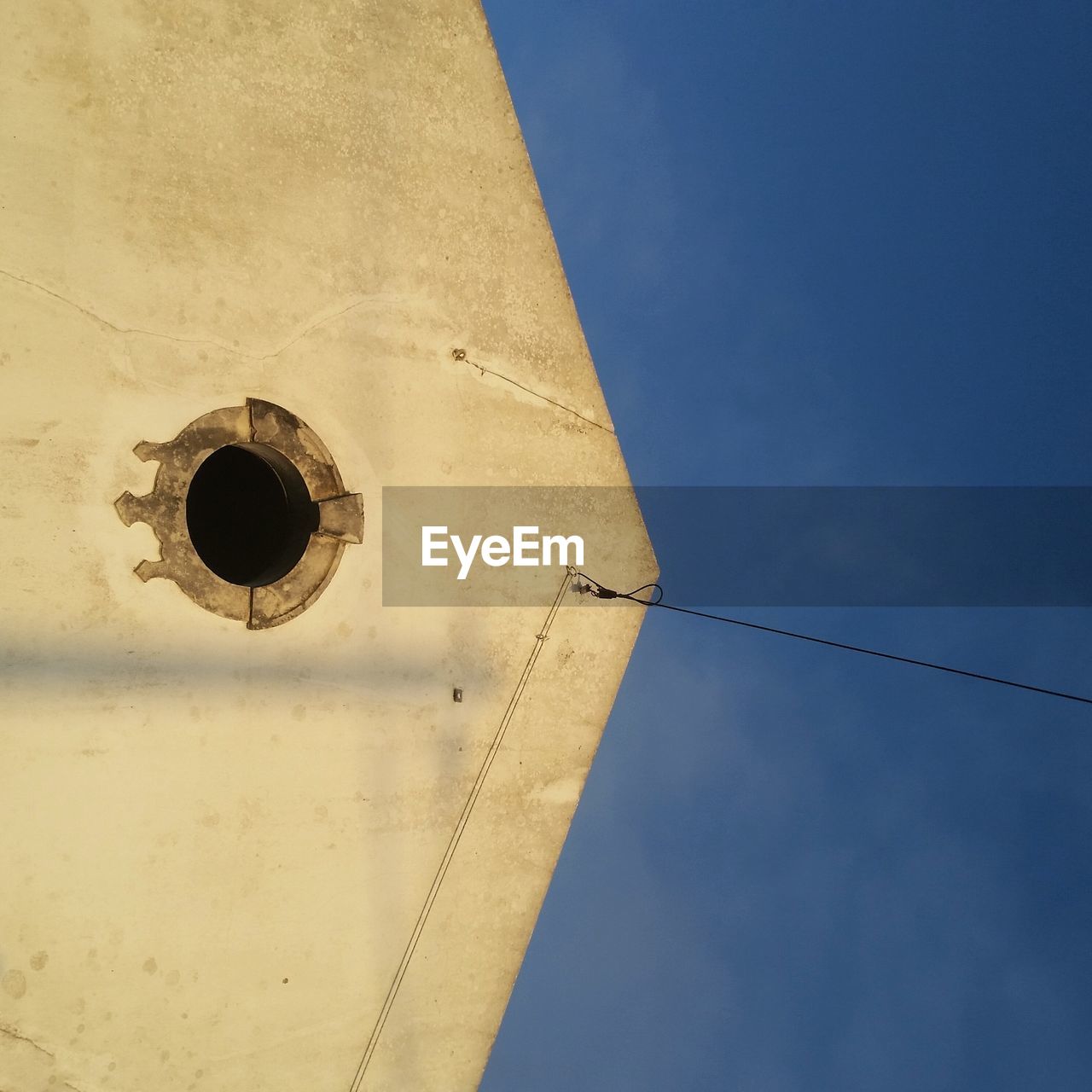 LOW ANGLE VIEW OF BELL TOWER AGAINST THE SKY