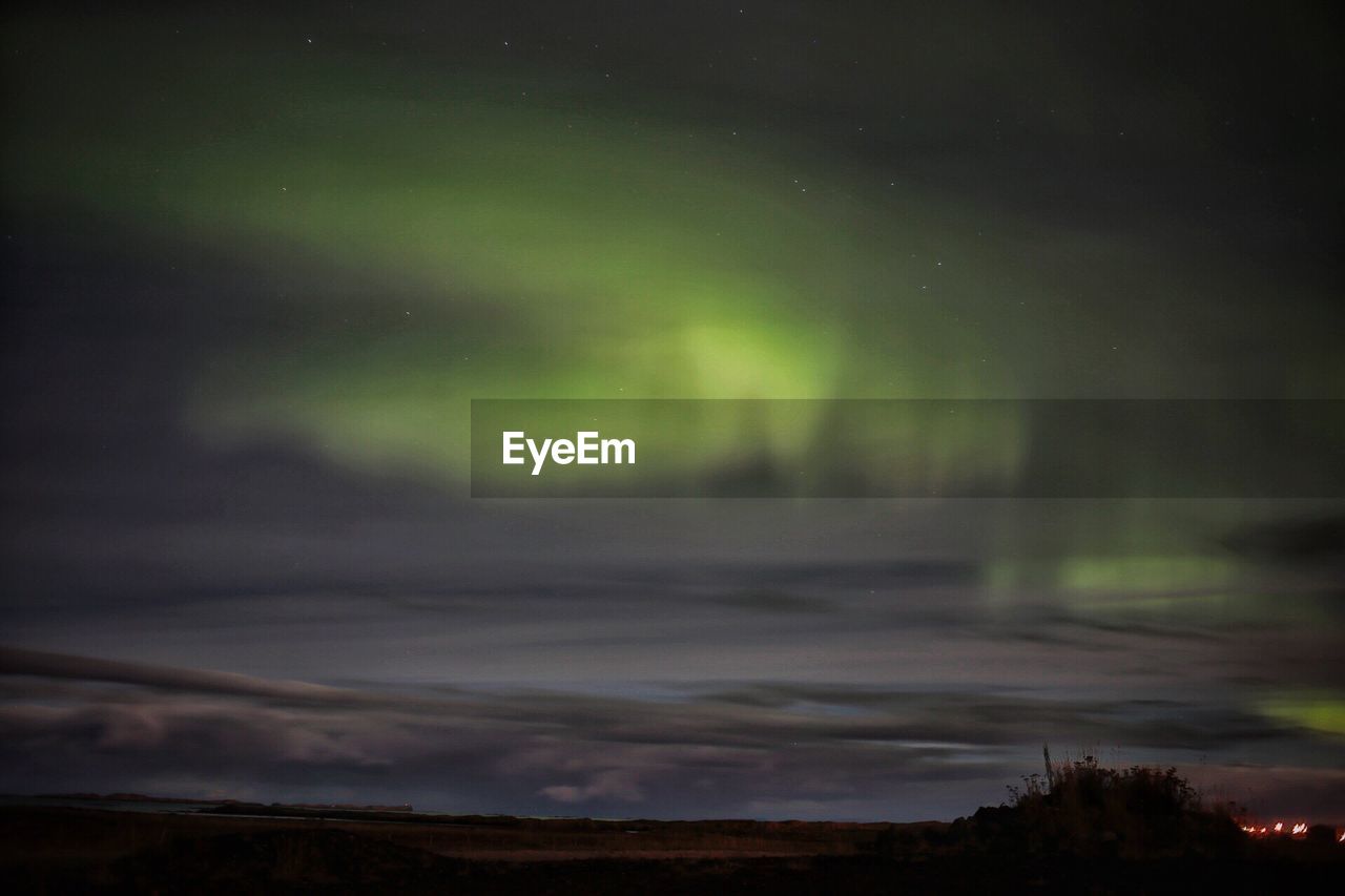 Scenic view of landscape against sky at night