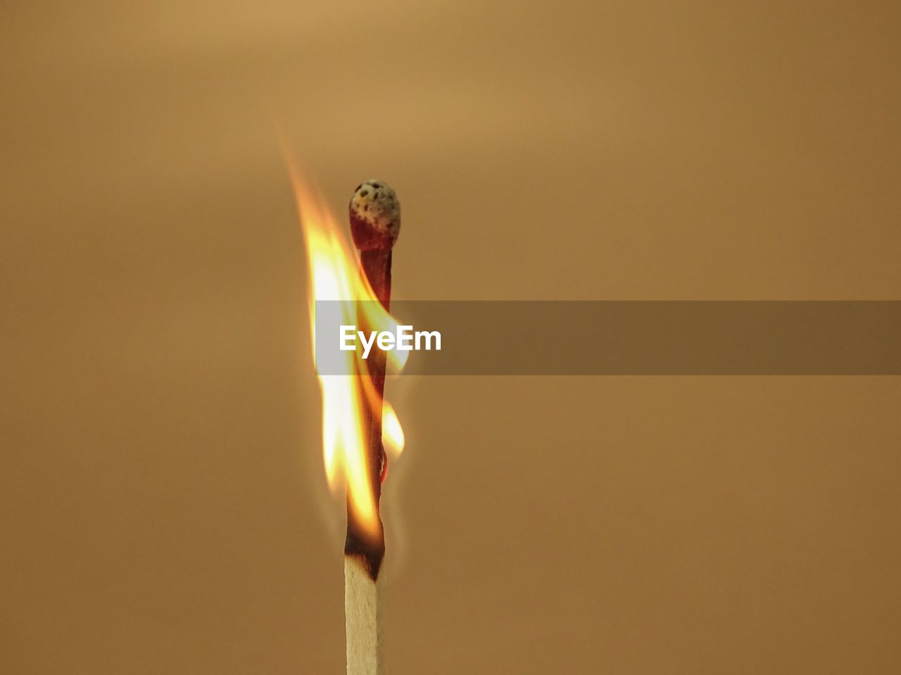 Close-up of burning matchstick 