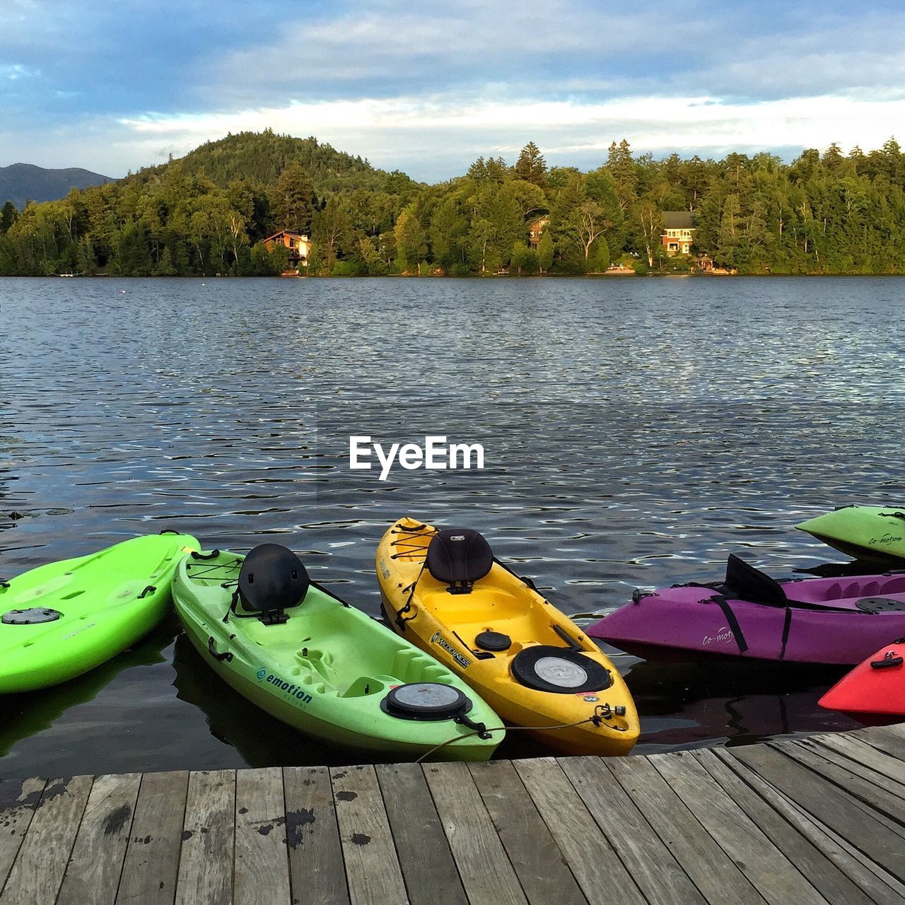 HIGH ANGLE VIEW OF SHOES BY LAKE