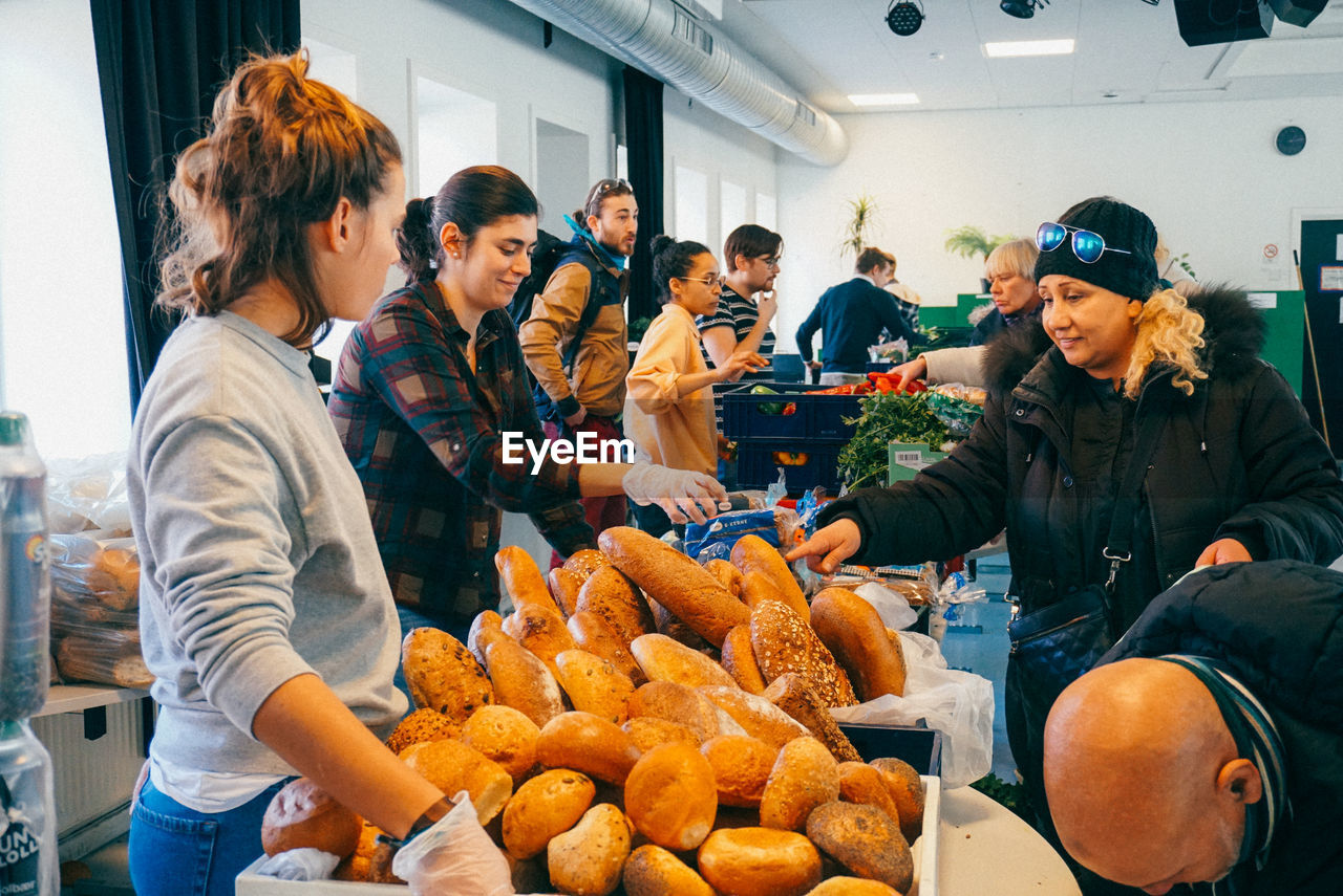 GROUP OF PEOPLE IN MARKET