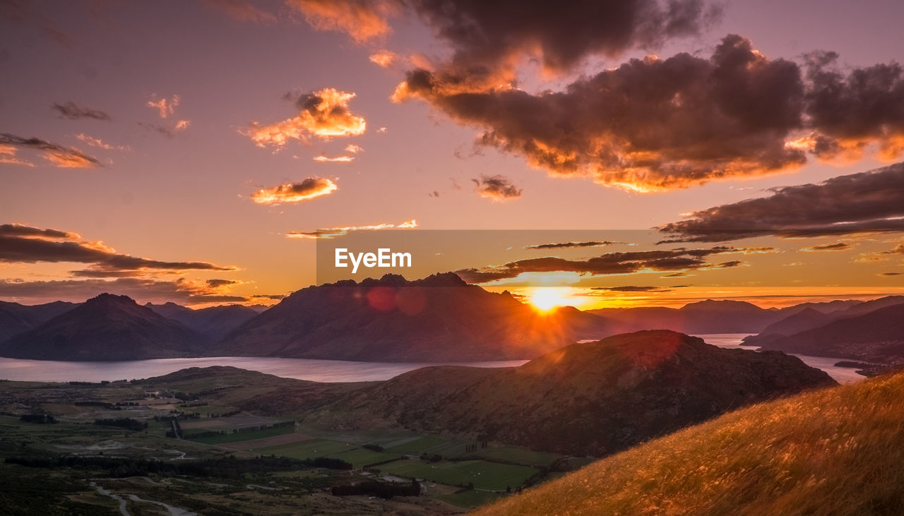 Scenic view of mountains against sky during sunset