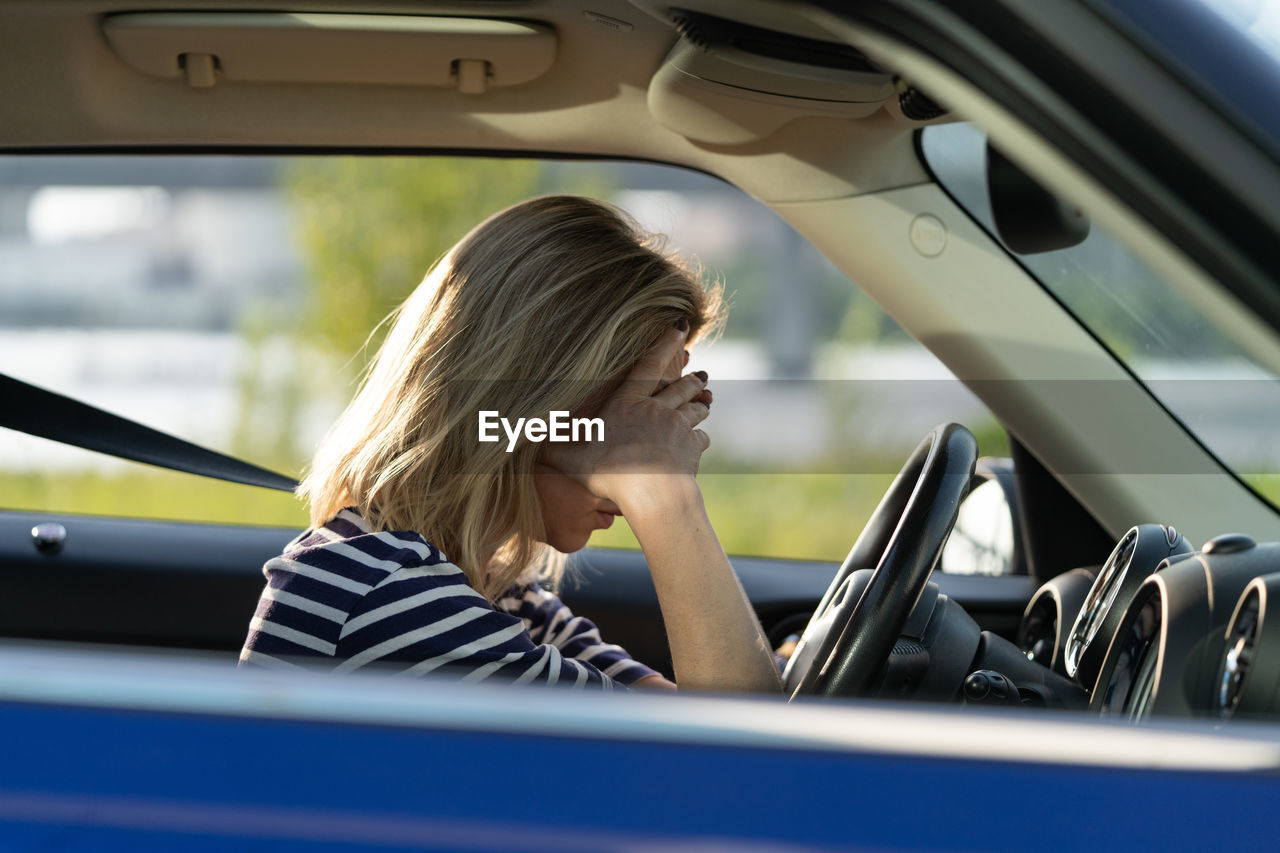 Girl driver feeling doubtful confused about difficult decision, suffering from burnout, life crisis