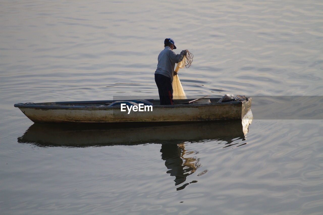 Man on boat in water