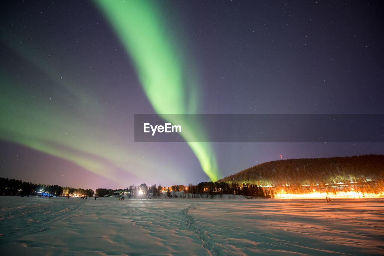 Scenic view of illuminated city against sky at night