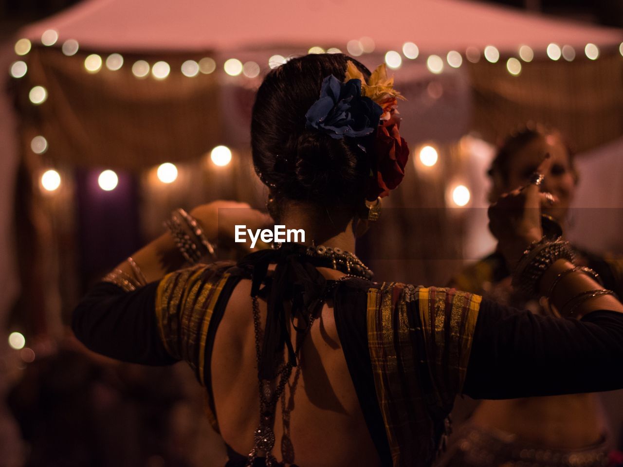 Women performing traditional dance at night