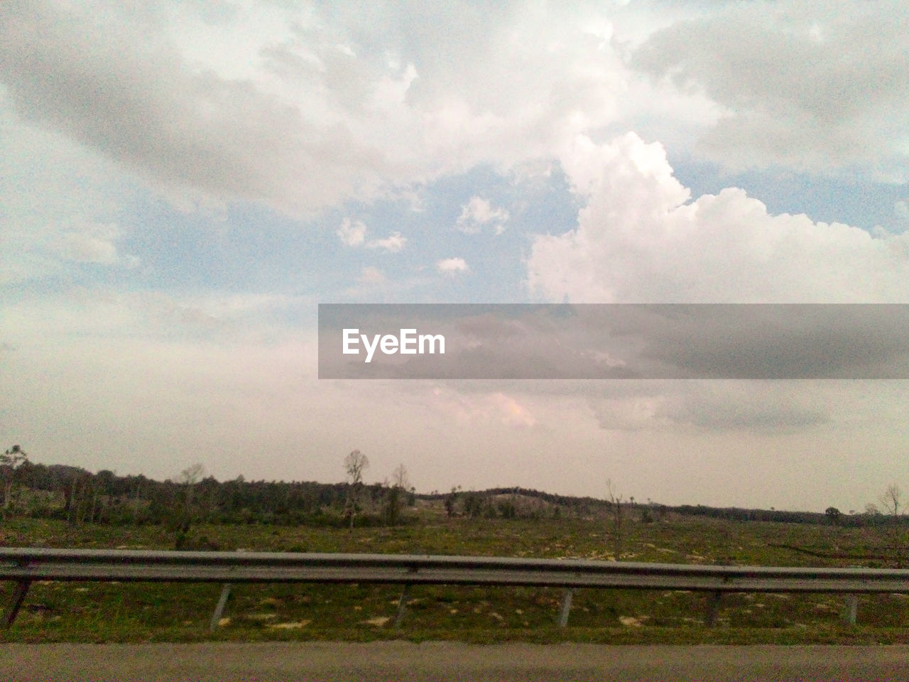 VIEW OF LANDSCAPE AGAINST CLOUDY SKY