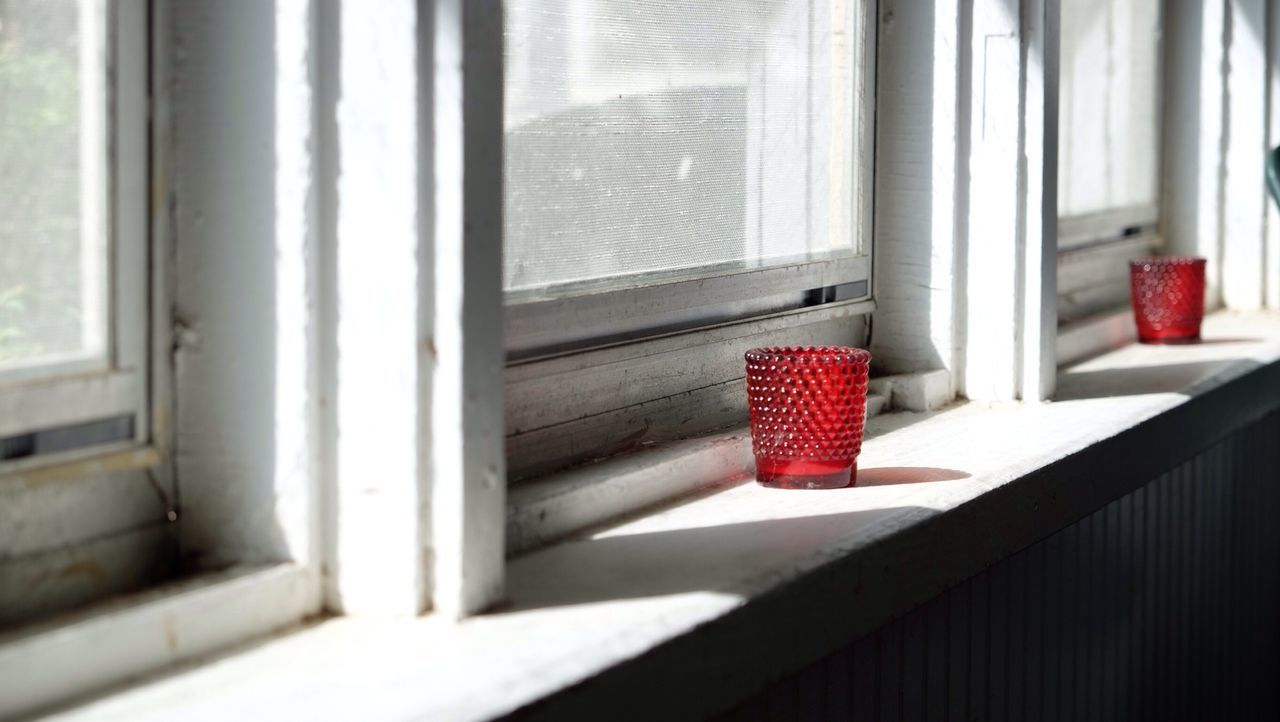 Sunlight passing through window of house