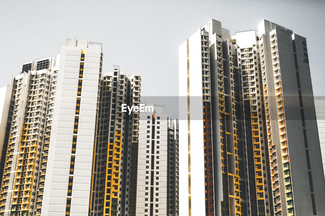 LOW ANGLE VIEW OF BUILDINGS AGAINST CLEAR SKY