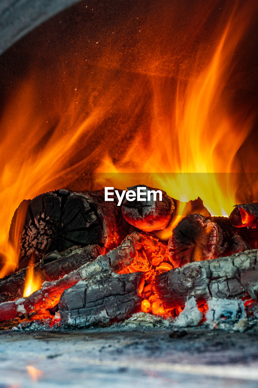 Red, orange and yellow flames from firewood in a oven