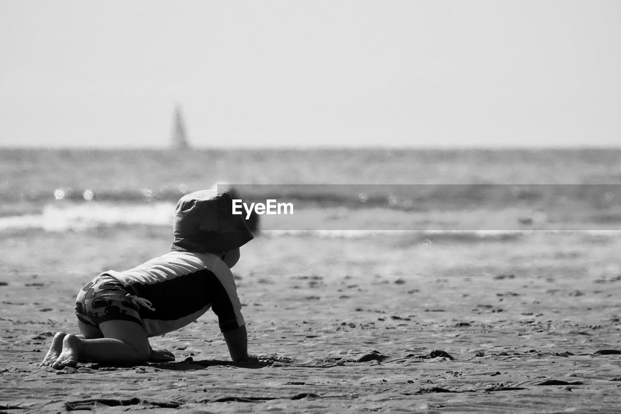 WOMAN RELAXING ON BEACH