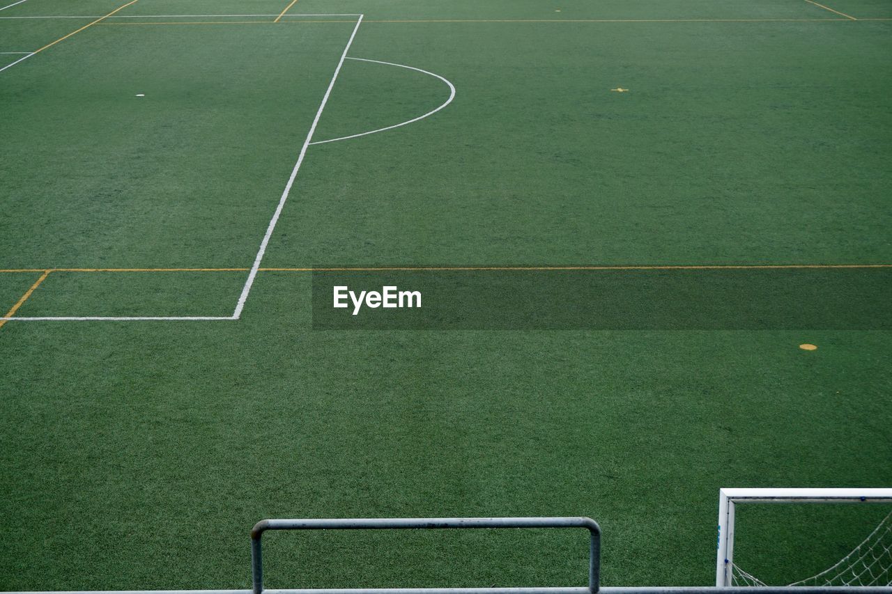 Empty soccer field, green grass in the stadium