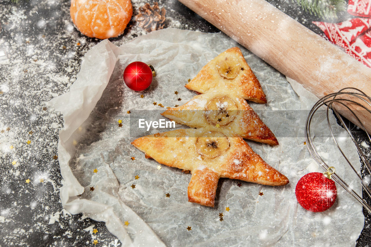  christmas decorations on parchment paper. christmas baking background.