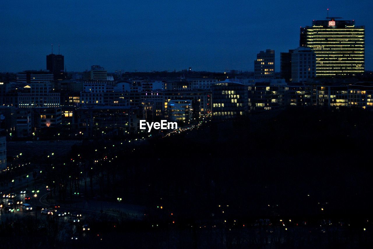 ILLUMINATED CITYSCAPE AT NIGHT