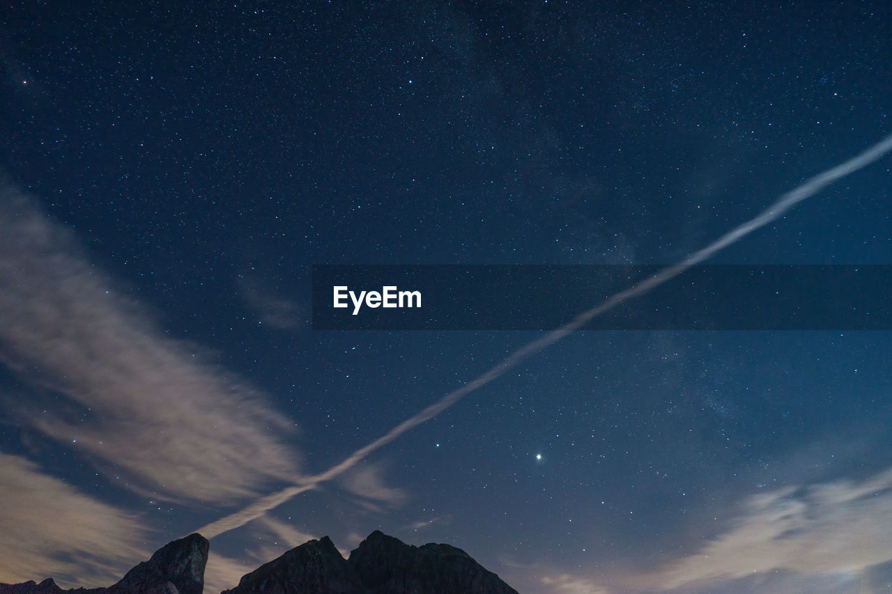 Low angle view of star field against sky at night