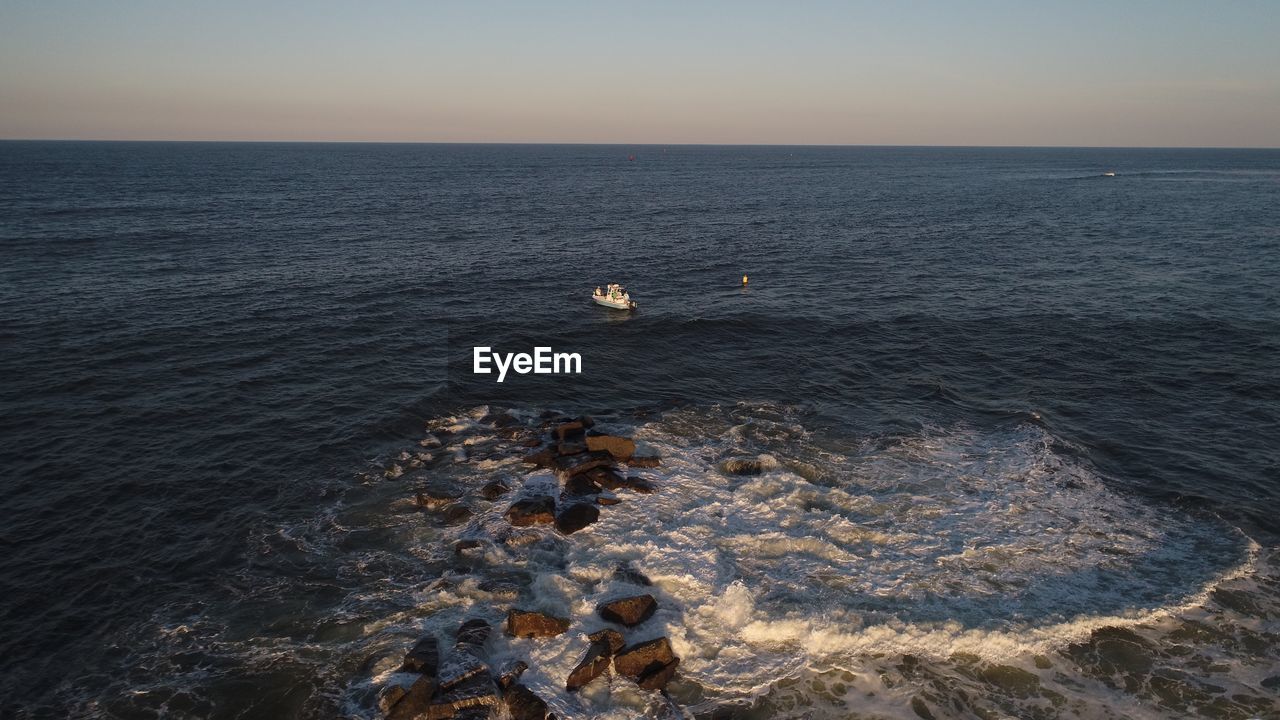 VIEW OF SEA AGAINST SKY DURING SUNSET