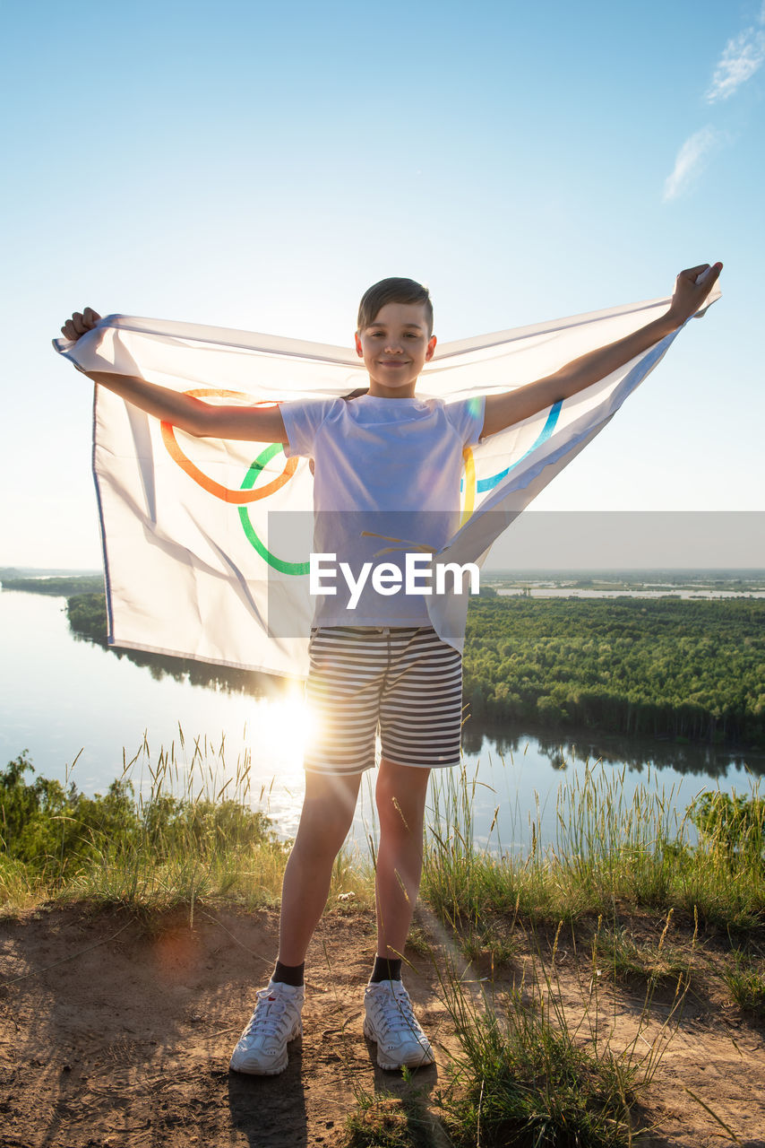 Full length portrait of man standing on land