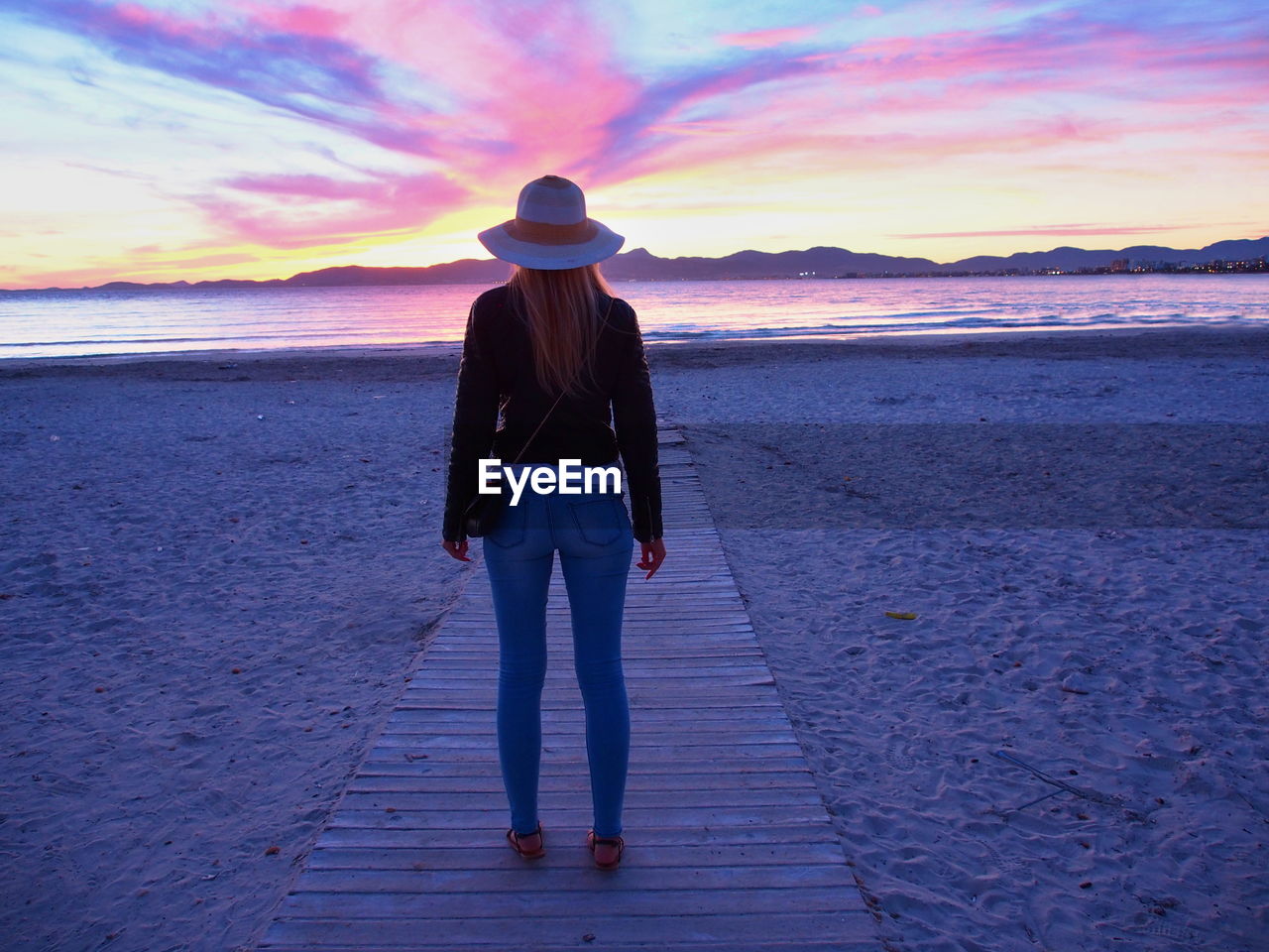 Rear view of woman on beach