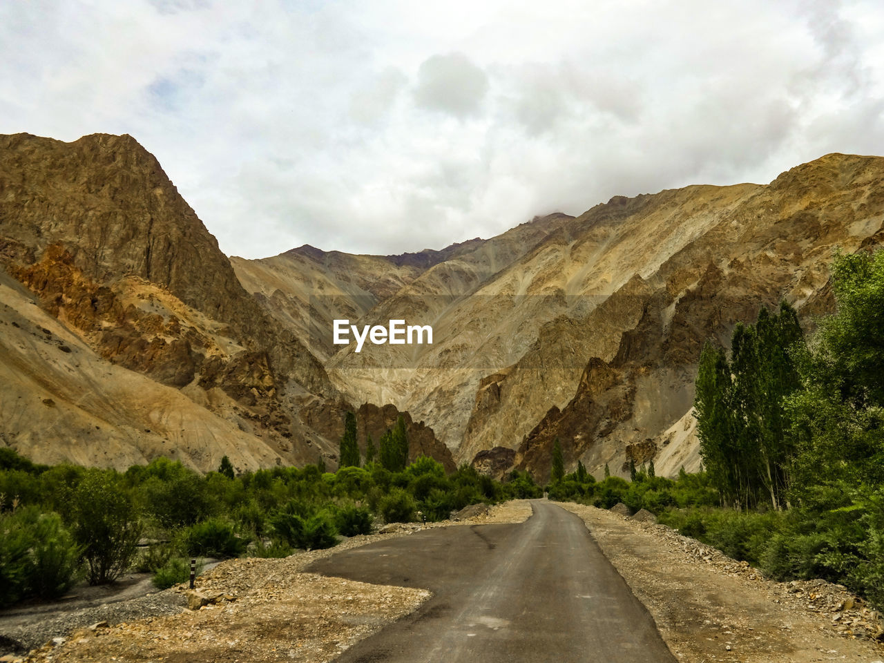 Scenic view of mountain road against sky