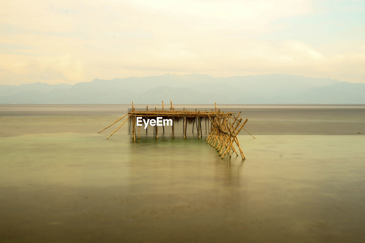 Pier on sea against sky