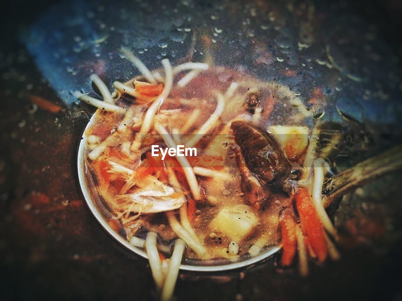 High angle view of soup in bowl on textured surface