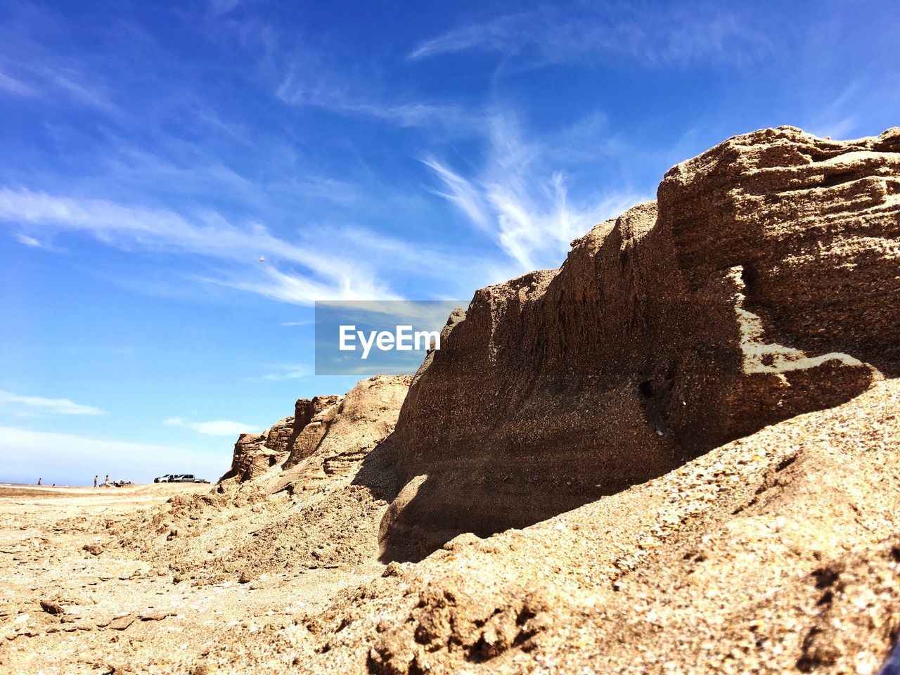 View of rock formations on landscape against sky