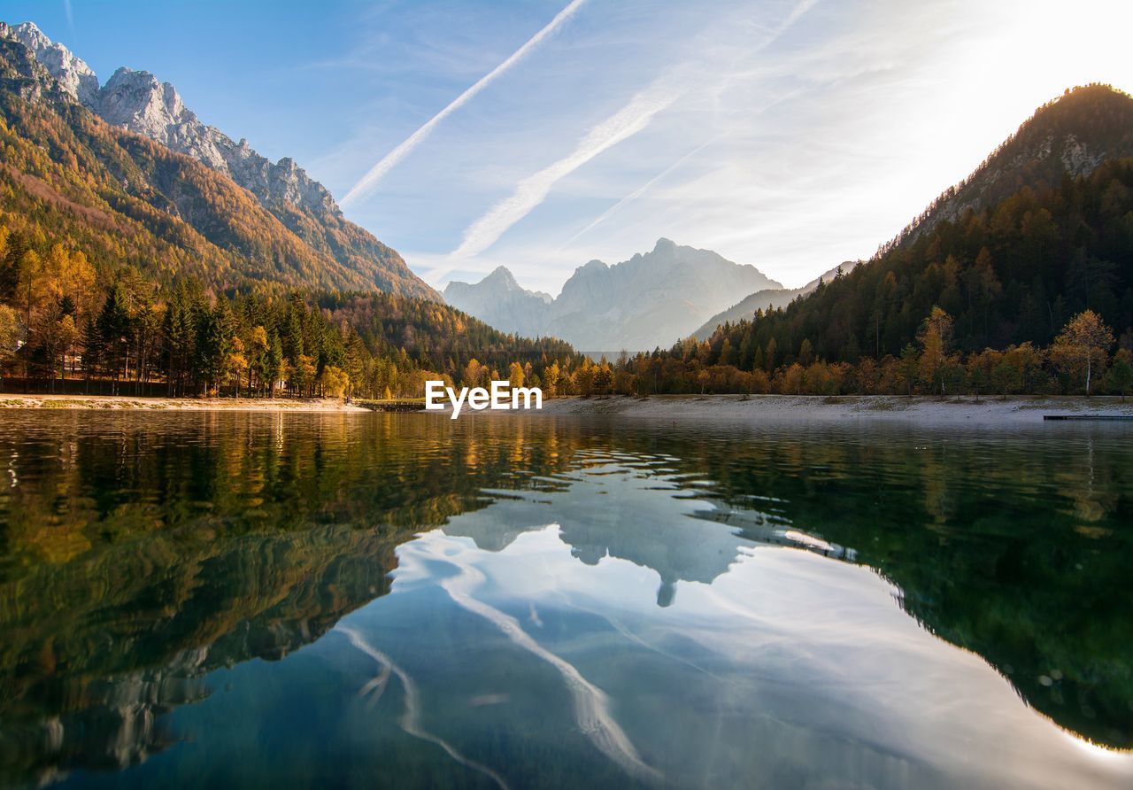 Scenic view of lake and mountains against sky