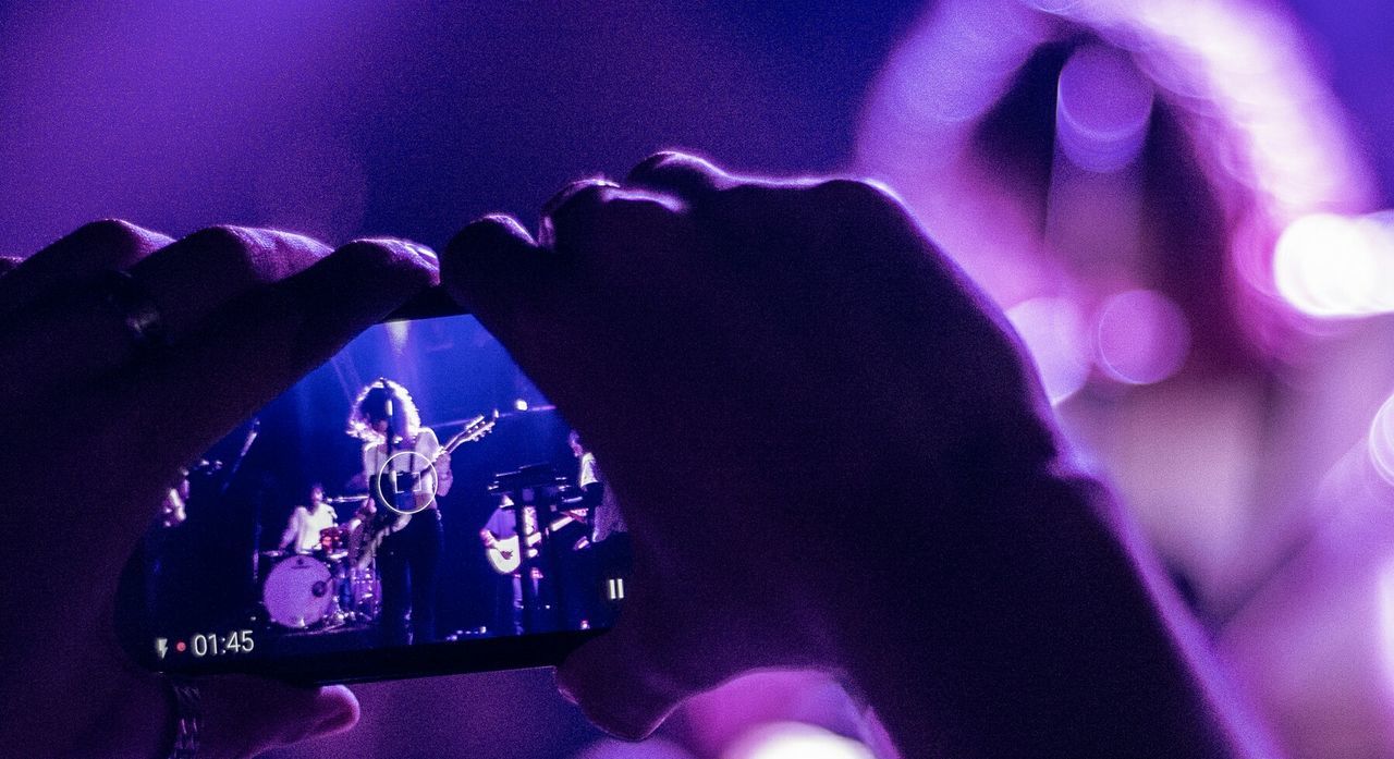 CLOSE-UP OF HANDS HOLDING PEOPLE