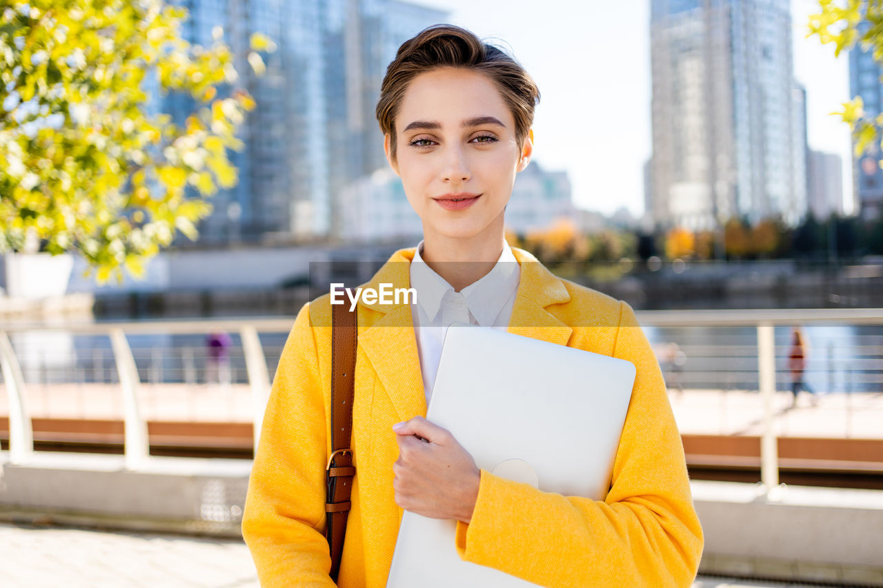 portrait of young woman using mobile phone