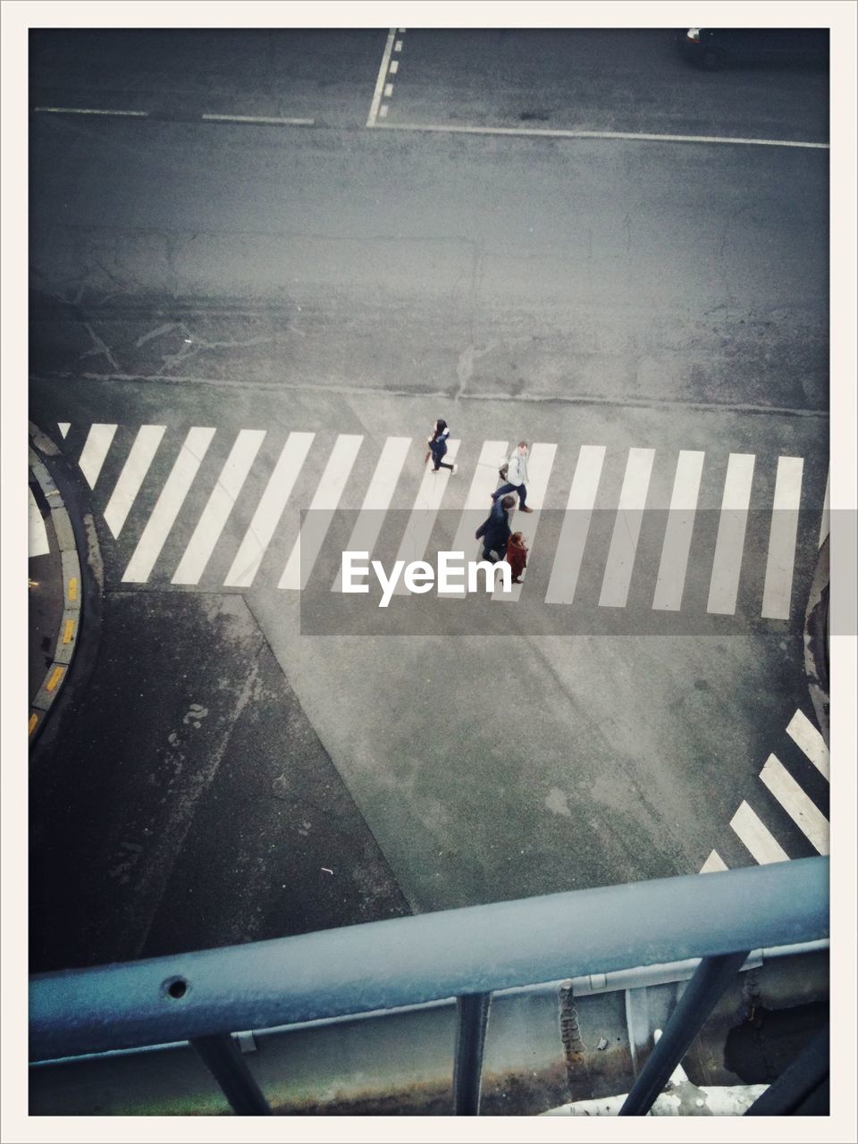 High angle view of people crossing street