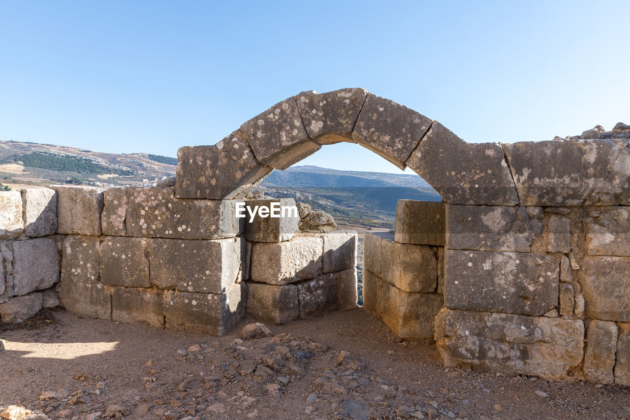 STONE WALL AGAINST CLEAR BLUE SKY