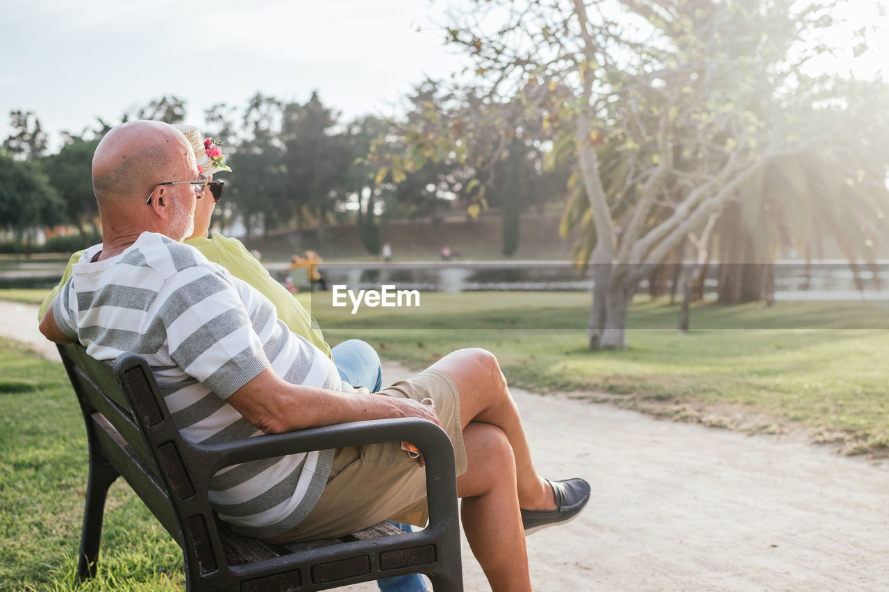 Pensioners couple sitting on a park