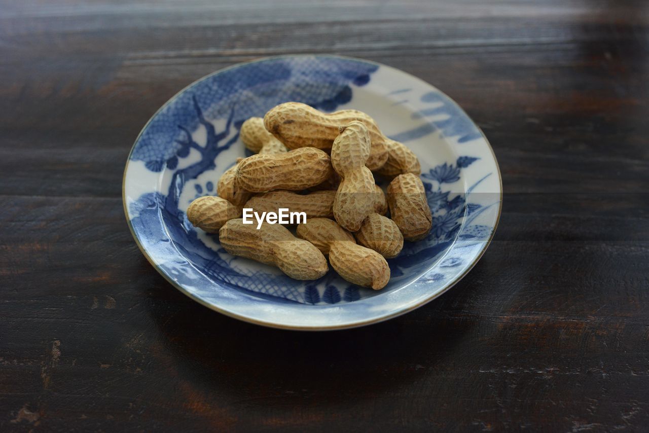 Directly above shot of peanuts in plate 