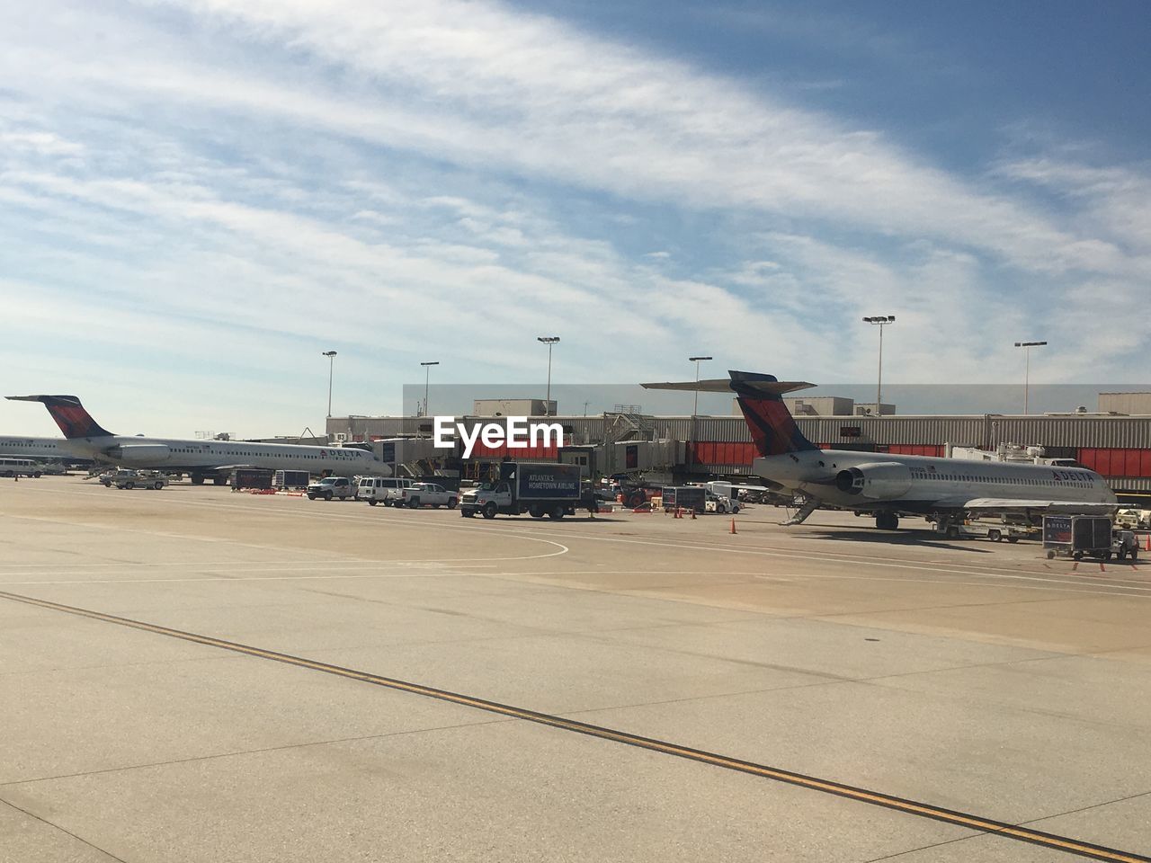 AIRPLANE AT AIRPORT AGAINST SKY