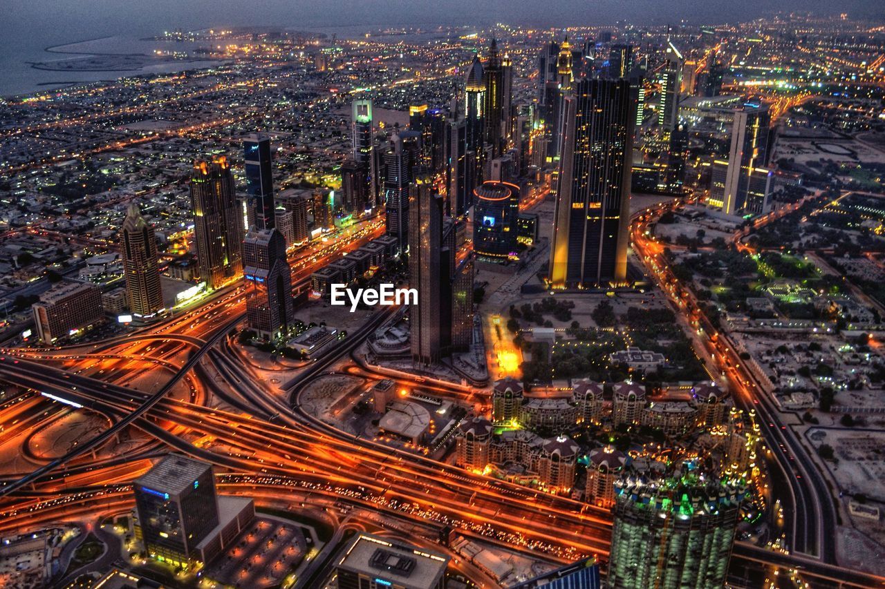 Aerial view of illuminated cityscape at dusk