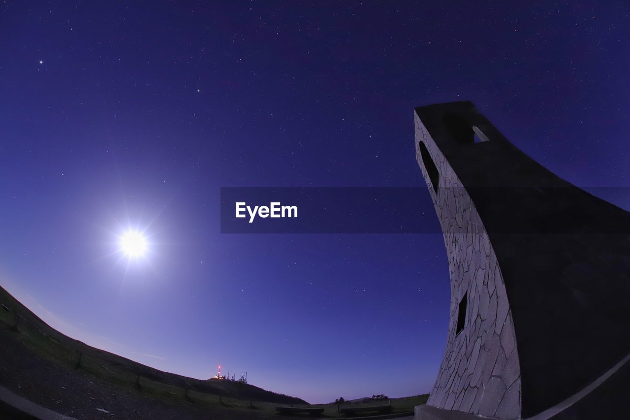 LOW ANGLE VIEW OF MOON AGAINST SKY AT NIGHT