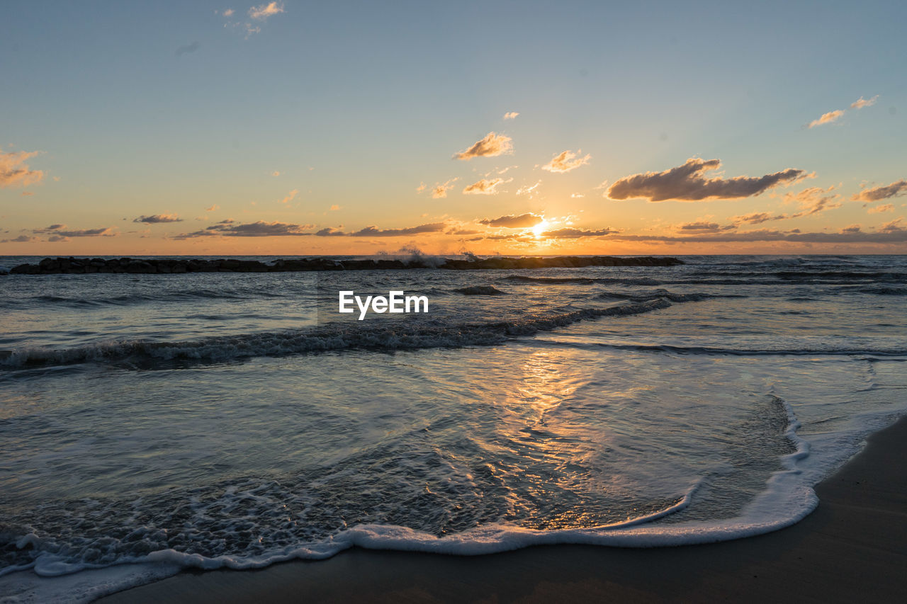 Scenic view of sea against sky during sunset