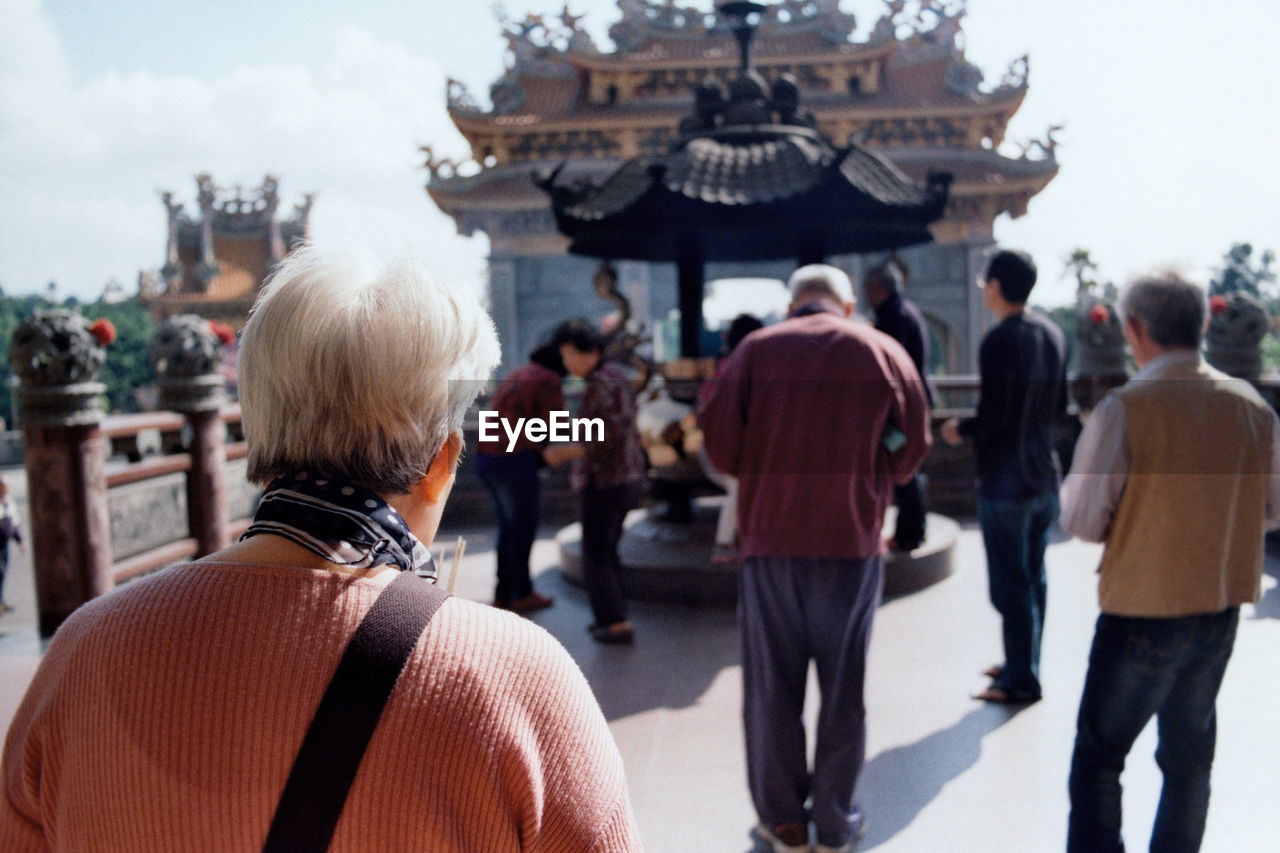 Rear view of people at temple